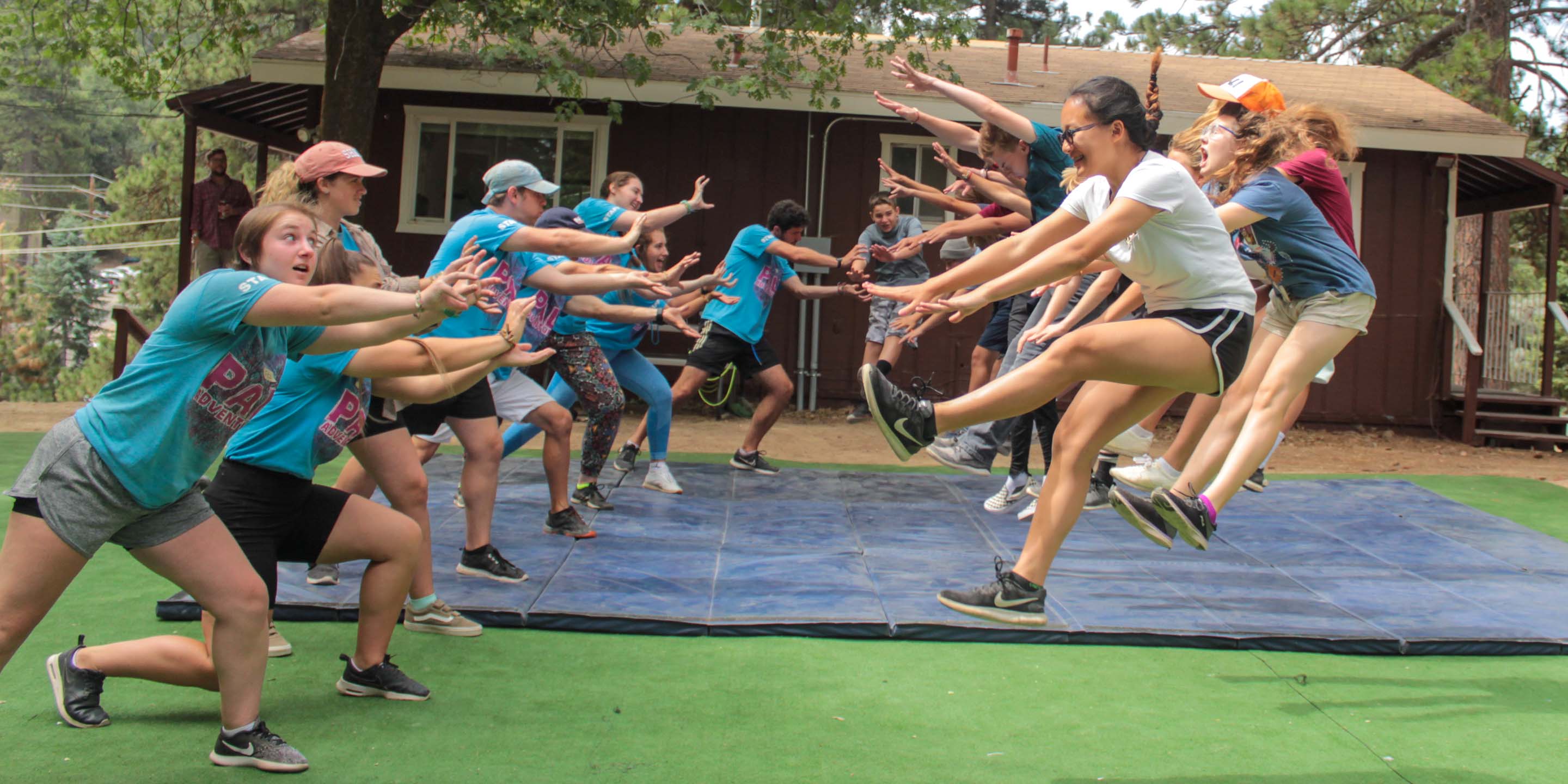 Staff and campers doing Hollywood stunts